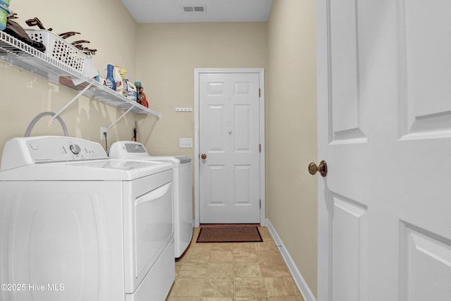 laundry room with independent washer and dryer