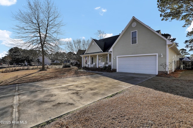 view of front property featuring a garage and covered porch