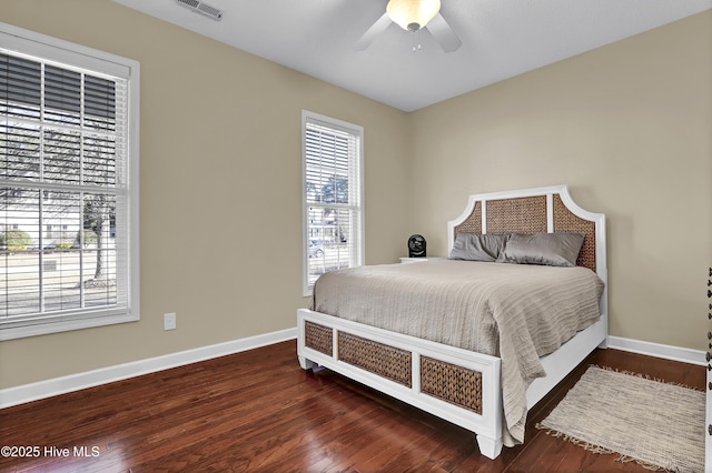 bedroom featuring ceiling fan and dark hardwood / wood-style flooring