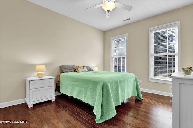 bedroom featuring dark hardwood / wood-style floors and ceiling fan