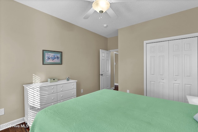 bedroom with ceiling fan and a closet