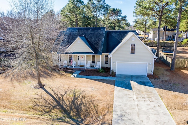 view of front of home with a garage and a porch