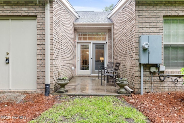 doorway to property with a patio