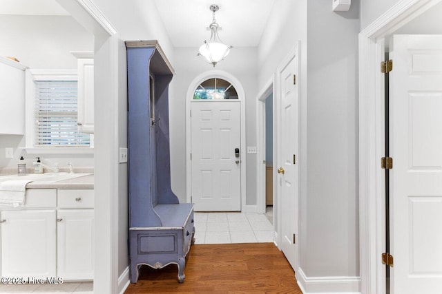 entryway featuring sink and light hardwood / wood-style floors