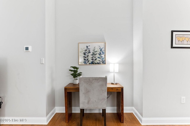 home office with hardwood / wood-style flooring