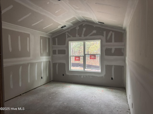 empty room with vaulted ceiling