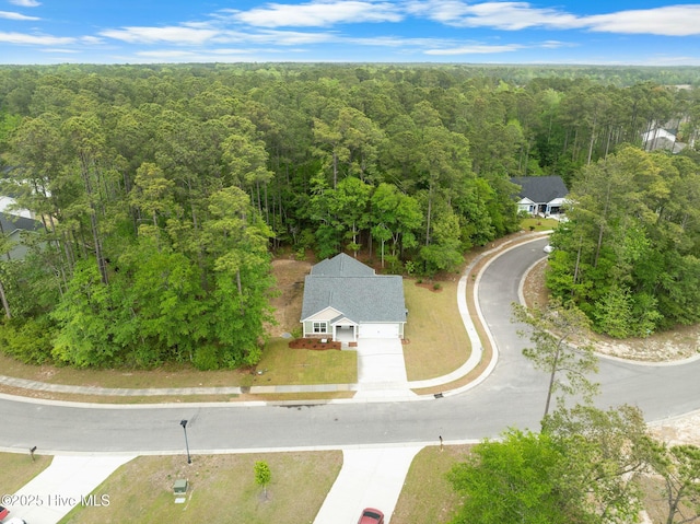 drone / aerial view with a view of trees