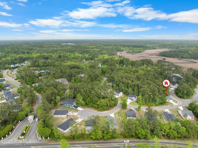 bird's eye view with a forest view