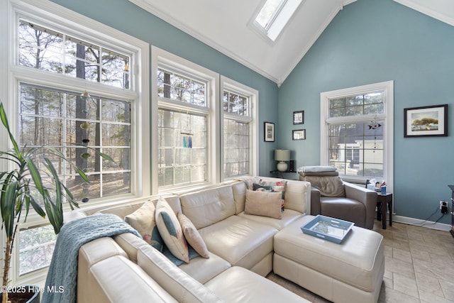 living room featuring a healthy amount of sunlight, high vaulted ceiling, and a skylight