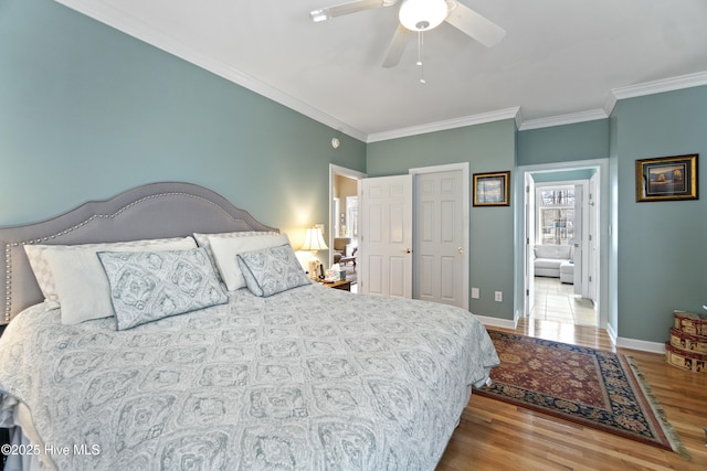 bedroom with ornamental molding, light hardwood / wood-style floors, and ceiling fan