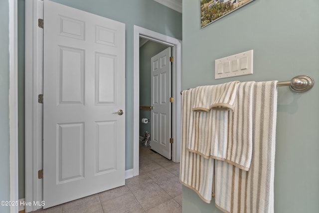 corridor with light tile patterned floors