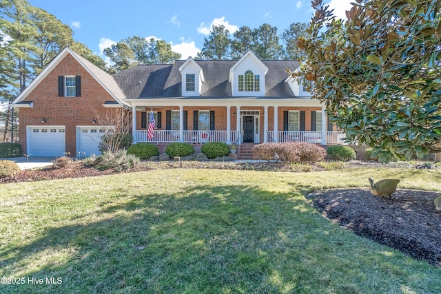 cape cod home with a porch, a garage, and a front lawn