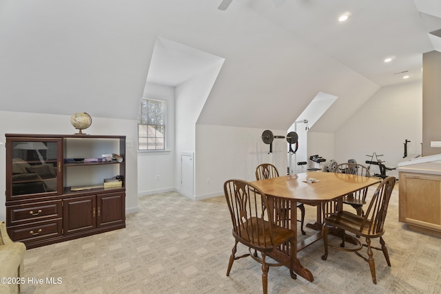 dining room featuring vaulted ceiling