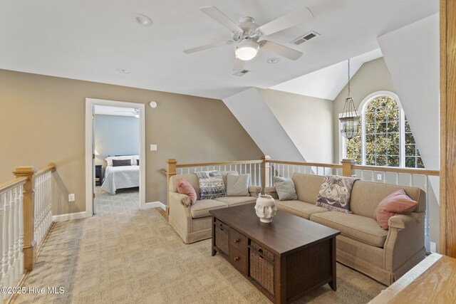 carpeted living room with lofted ceiling and ceiling fan