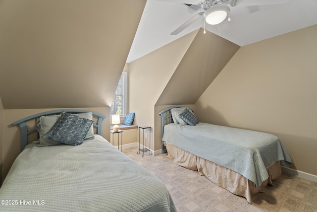 bedroom with vaulted ceiling, light colored carpet, and ceiling fan