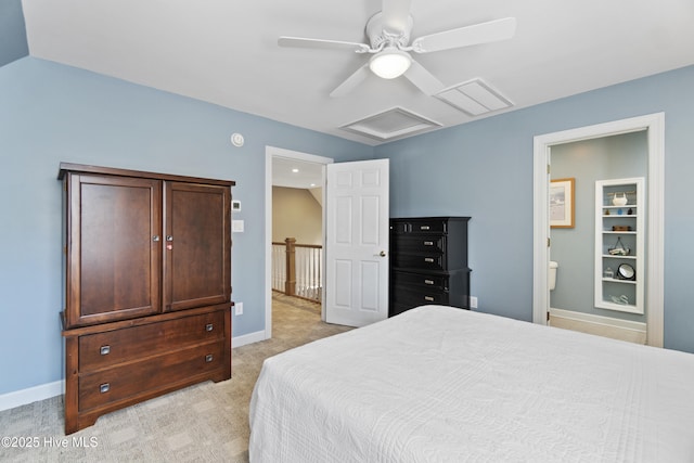 bedroom featuring connected bathroom, light colored carpet, and ceiling fan