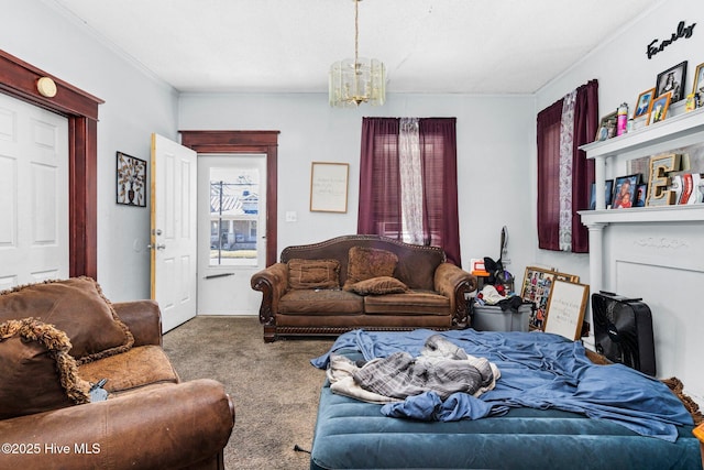 living room featuring an inviting chandelier, ornamental molding, and carpet floors