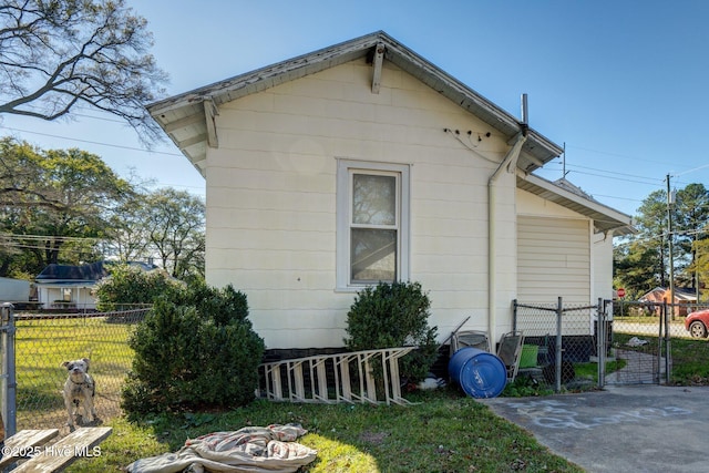 view of home's exterior featuring a patio and a yard