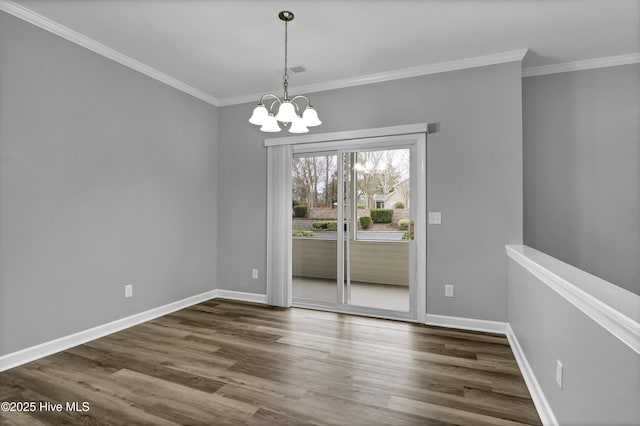 unfurnished dining area featuring an inviting chandelier, dark wood-type flooring, and ornamental molding