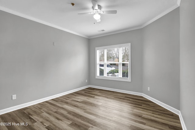 spare room with crown molding, wood-type flooring, and ceiling fan