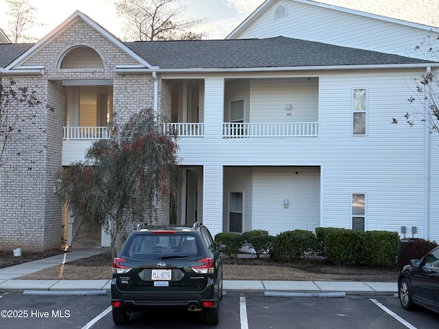 view of front of property with a balcony