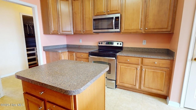 kitchen featuring stainless steel appliances and a kitchen island