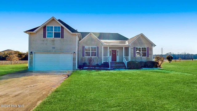 view of front of home featuring a garage and a front lawn