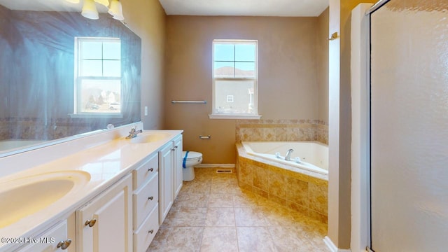 full bathroom with tile patterned flooring, vanity, shower with separate bathtub, and toilet