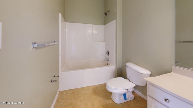 full bathroom with tile patterned flooring,  shower combination, vanity, and toilet