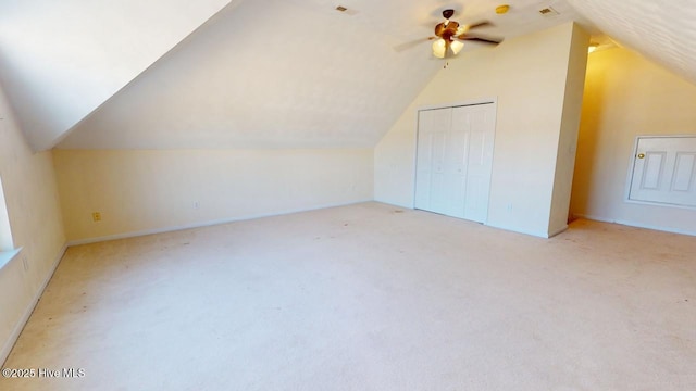 bonus room featuring vaulted ceiling, light carpet, and ceiling fan