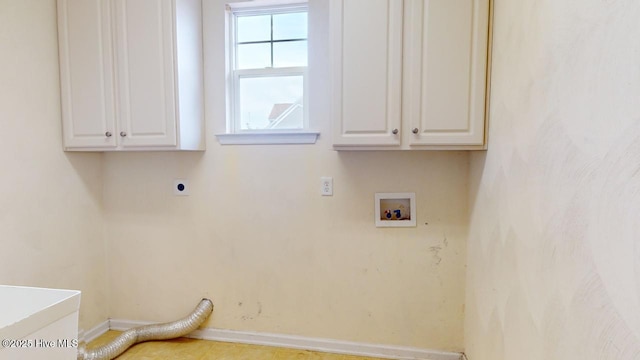 washroom featuring cabinets, washer hookup, and electric dryer hookup