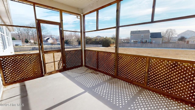 unfurnished sunroom featuring a wealth of natural light