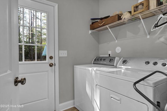 clothes washing area with washing machine and clothes dryer