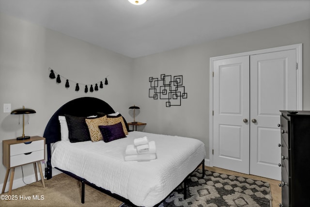 carpeted bedroom featuring a closet