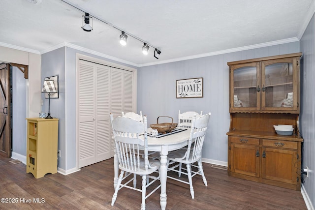 dining area with dark wood-style floors, ornamental molding, visible vents, and baseboards