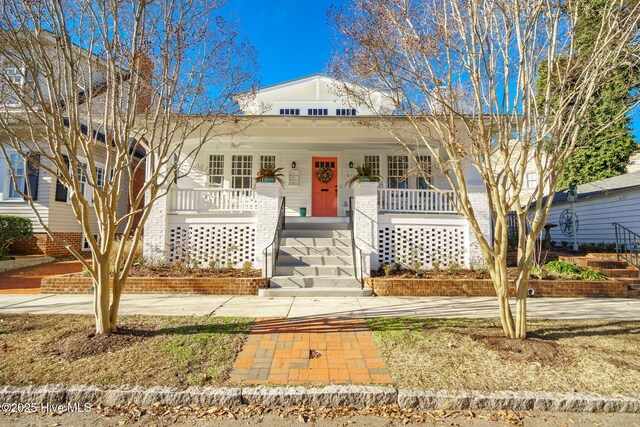 view of front facade featuring an outbuilding and covered porch