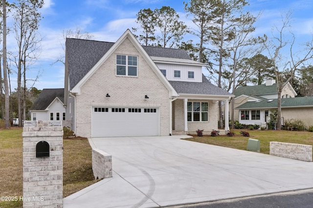 view of front of home featuring a garage and a front lawn