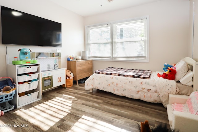 bedroom with wood finished floors