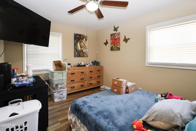 bedroom featuring wood finished floors and a ceiling fan