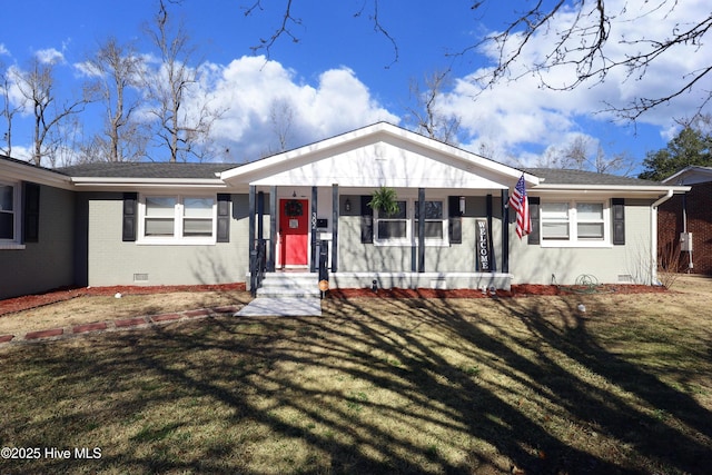 view of front facade with a shingled roof, a front yard, crawl space, and brick siding