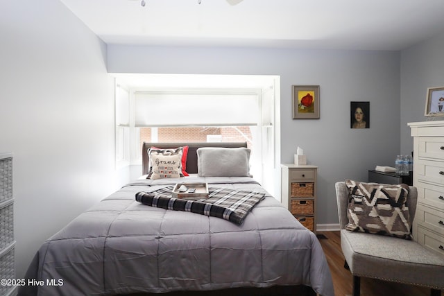 bedroom with wood finished floors