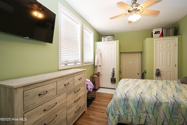 bedroom featuring ceiling fan and light wood finished floors