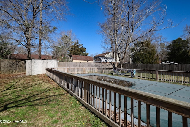 view of yard with a fenced backyard and a swimming pool