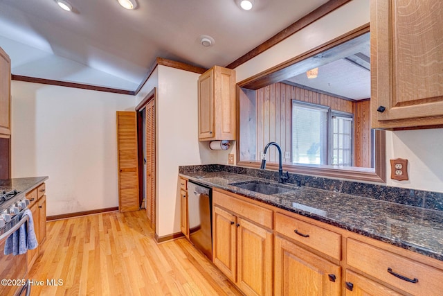 kitchen featuring light brown cabinetry, sink, dark stone counters, light hardwood / wood-style floors, and stainless steel appliances