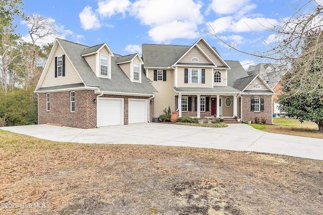 view of front of house featuring driveway, covered porch, a shingled roof, and brick siding