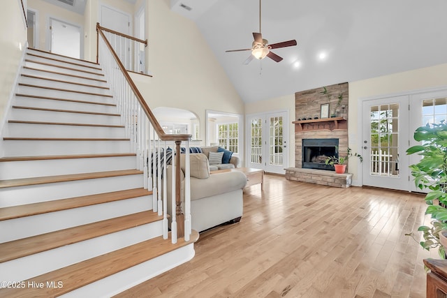 232 E Ivybridge Dr, Hubert, NC 28539 - living room featuring high vaulted ceiling, a ceiling fan, plenty of natural light, and stairs