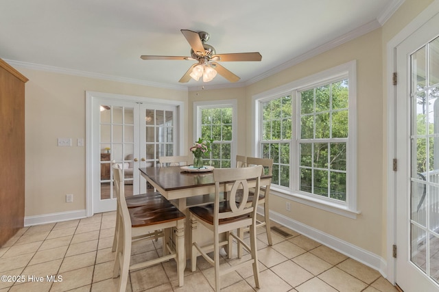 232 E Ivybridge Dr, Hubert, NC 28539 - dining area with light tile patterned flooring, crown molding, and plenty of natural light