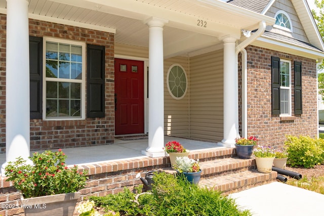 232 E Ivybridge Dr, Hubert, NC 28539 - property entrance with covered porch and brick siding