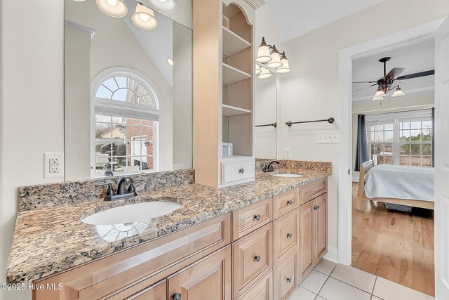 232 E Ivybridge Dr, Hubert, NC 28539 - ensuite bathroom featuring double vanity, ceiling fan, lofted ceiling, and tile patterned floors