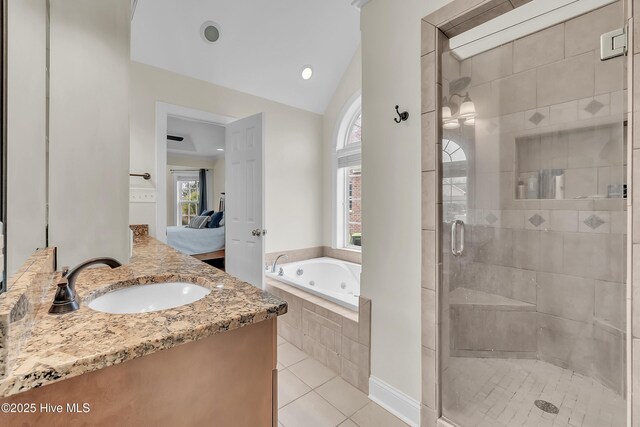 232 E Ivybridge Dr, Hubert, NC 28539 - ensuite bathroom featuring a stall shower, a whirlpool tub, healthy amount of natural light, tile patterned floors, and vaulted ceiling